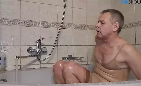 Crossdresser Masturbates in Tub with Stockings and Latex Gown